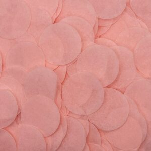 Pink paper confetti in a pile.